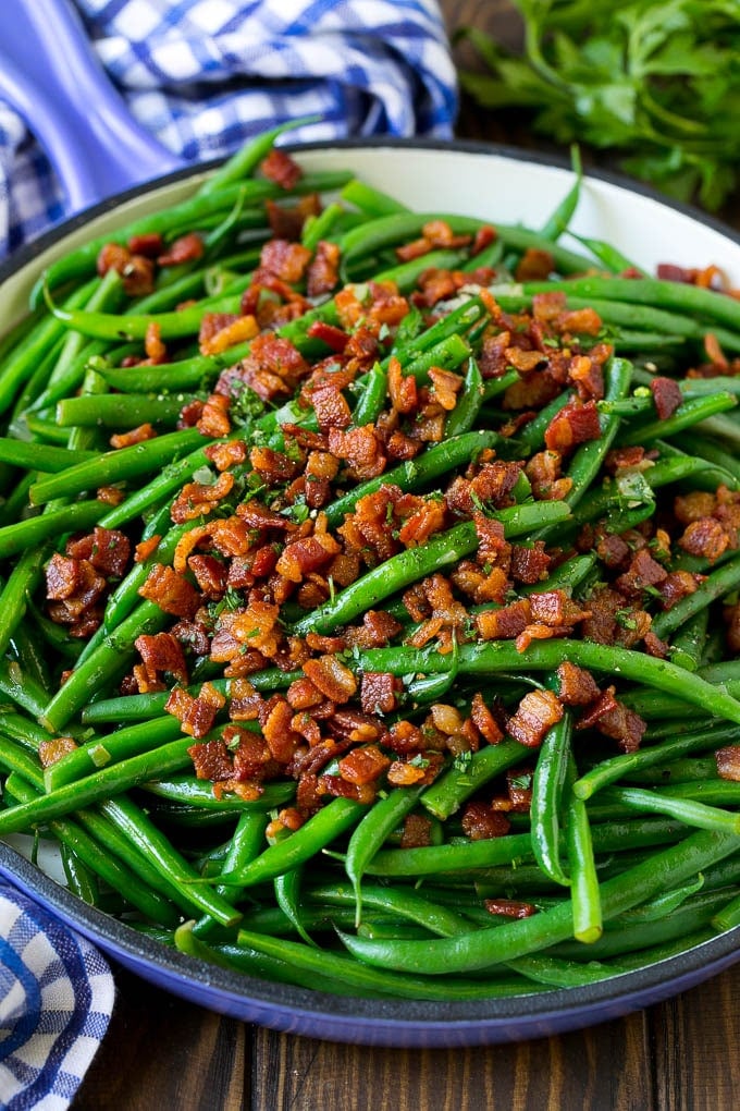Green Beans with Bacon Recipe | Bacon Green Beans #bacon #greenbeans #sidedish #thanksgiving #veggies #dinner #ezlod Green beans with bacon in a skillet, topped with parsley.
