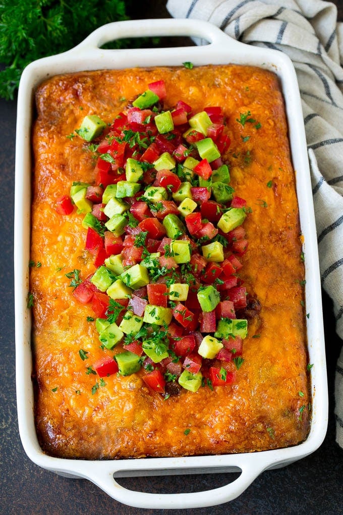 Sausage Egg Casserole Recipe | Egg Casserole #eggs #sausage #potato #cheese #casserole #breakfast #brunch #ezlod Sausage egg casserole topped with avocado and tomato.