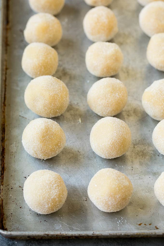 Thumbprint Cookies | Sugar Cookies #cookies #baking #christmas #dessert #ezlod Balls of cookie dough rolled in sugar.