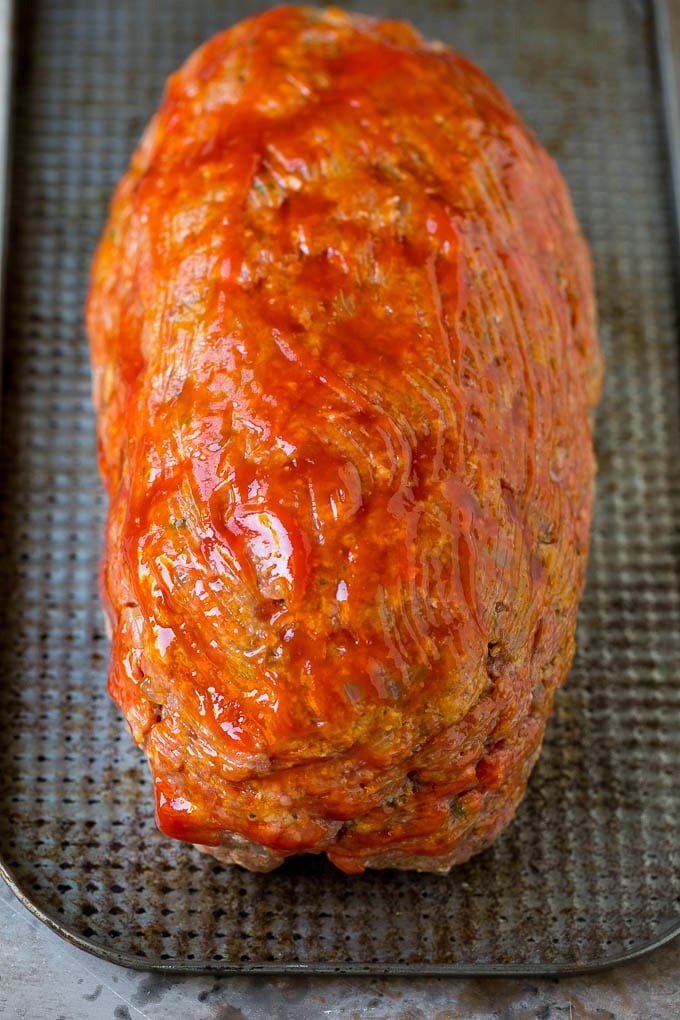 Bacon Wrapped Meatloaf Recipe | Beef Meatloaf #meatloaf #beef #groundbeef #bacon #dinner #ezlod Ground beef shaped into a loaf and coated in ketchup.