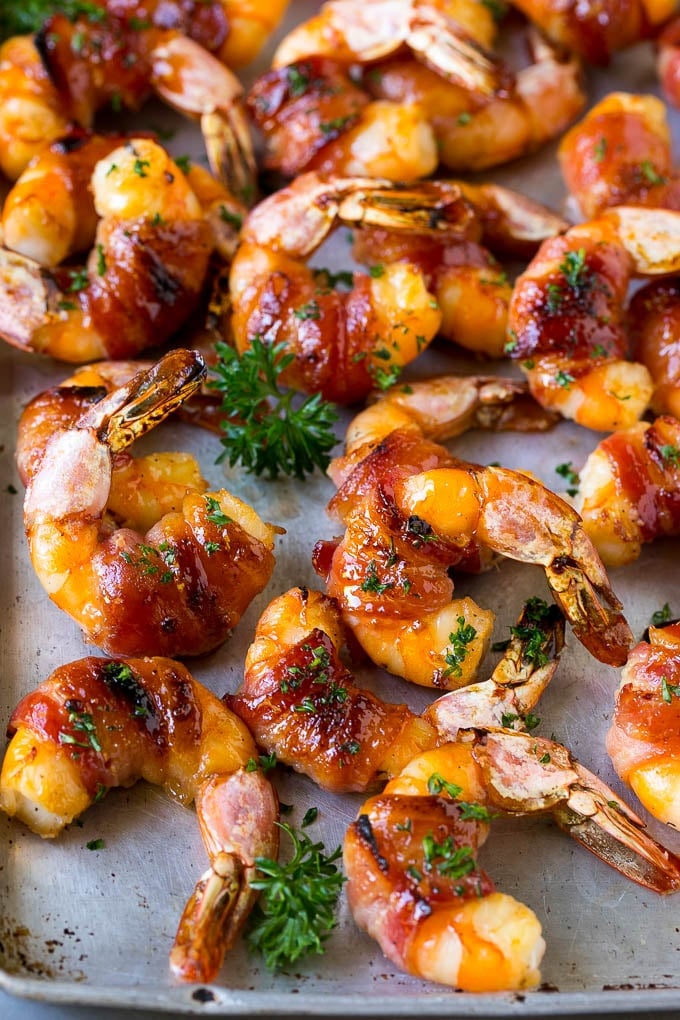 Bacon Wrapped Shrimp Recipe | Bacon Shrimp #shrimp #bacon #appetizer #dinner #ezlod #seafood Bacon wrapped shrimp in a sweet and savory glaze, garnished with parsley.
