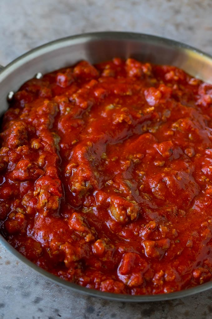 Baked Spaghetti Recipe | Baked Pasta #spaghetti #pasta #cheese #casserole #beef #sausage #dinner #ezlod Meat sauce in a skillet.