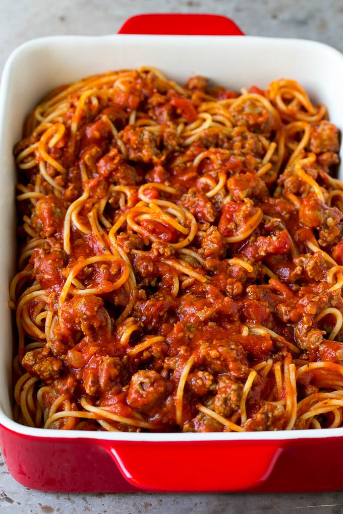 Baked Spaghetti Recipe | Baked Pasta #spaghetti #pasta #cheese #casserole #beef #sausage #dinner #ezlod Pasta tossed with meat sauce in a dish.