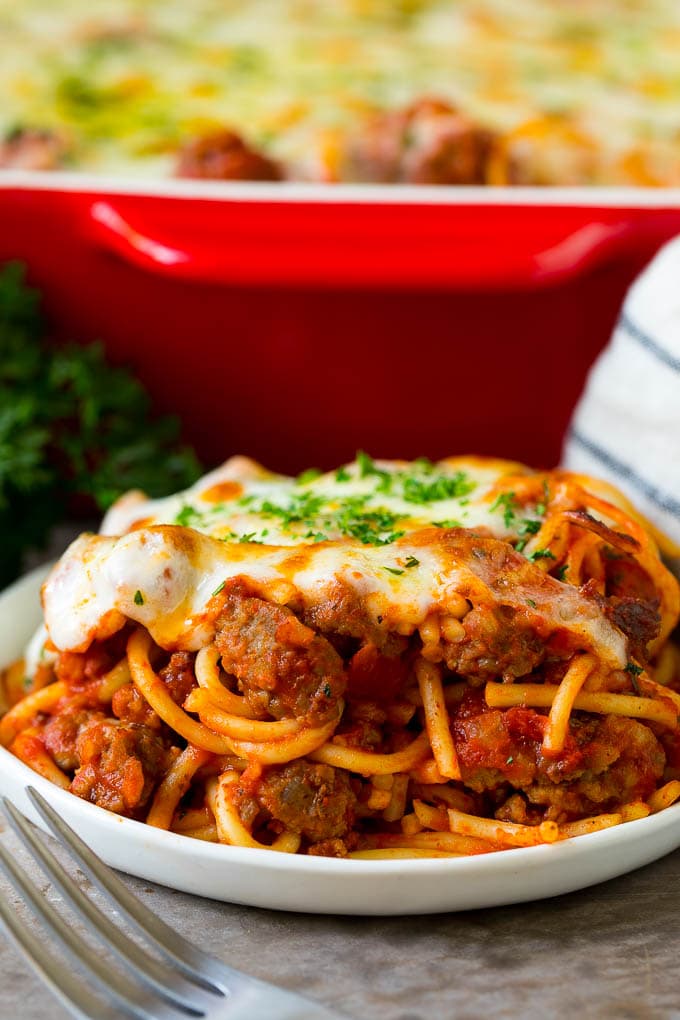 Baked Spaghetti Recipe | Baked Pasta #spaghetti #pasta #cheese #casserole #beef #sausage #dinner #ezlod A serving of baked spaghetti topped with melted cheese.