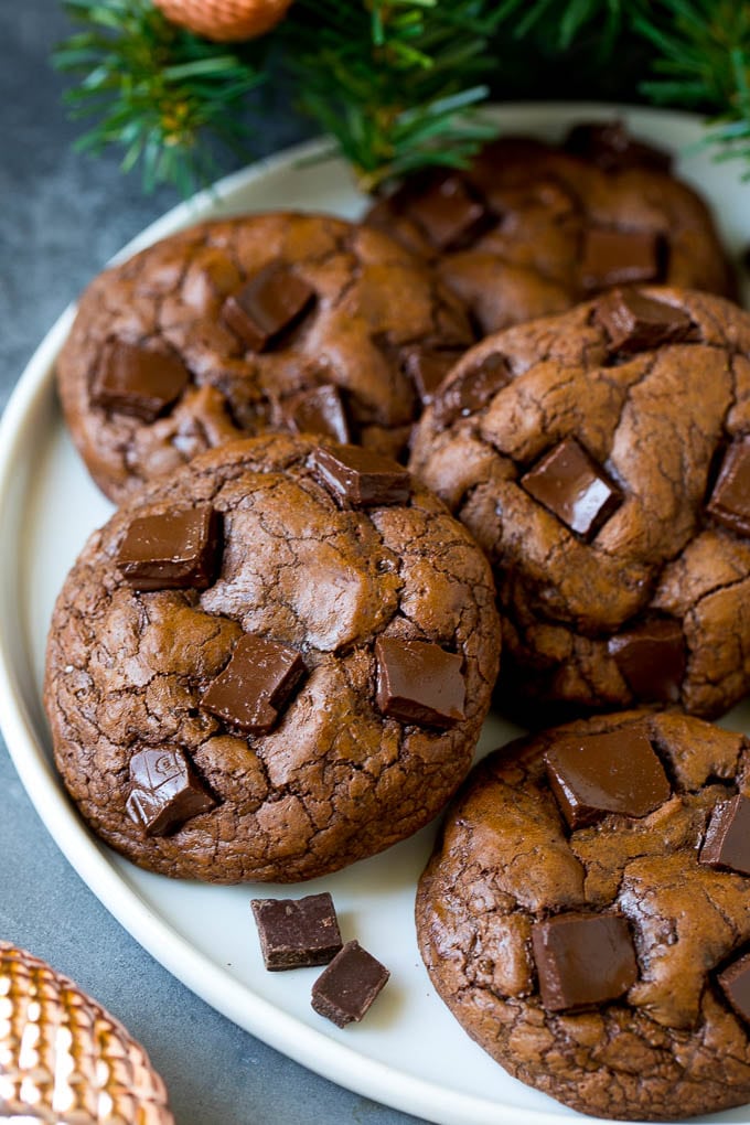 Brownie Cookies Recipe | Chocolate Cookies #cookies #brownies #chocolate #dessert #baking #ezlod Brownie cookies on a serving plate, topped with chocolate chunks.
