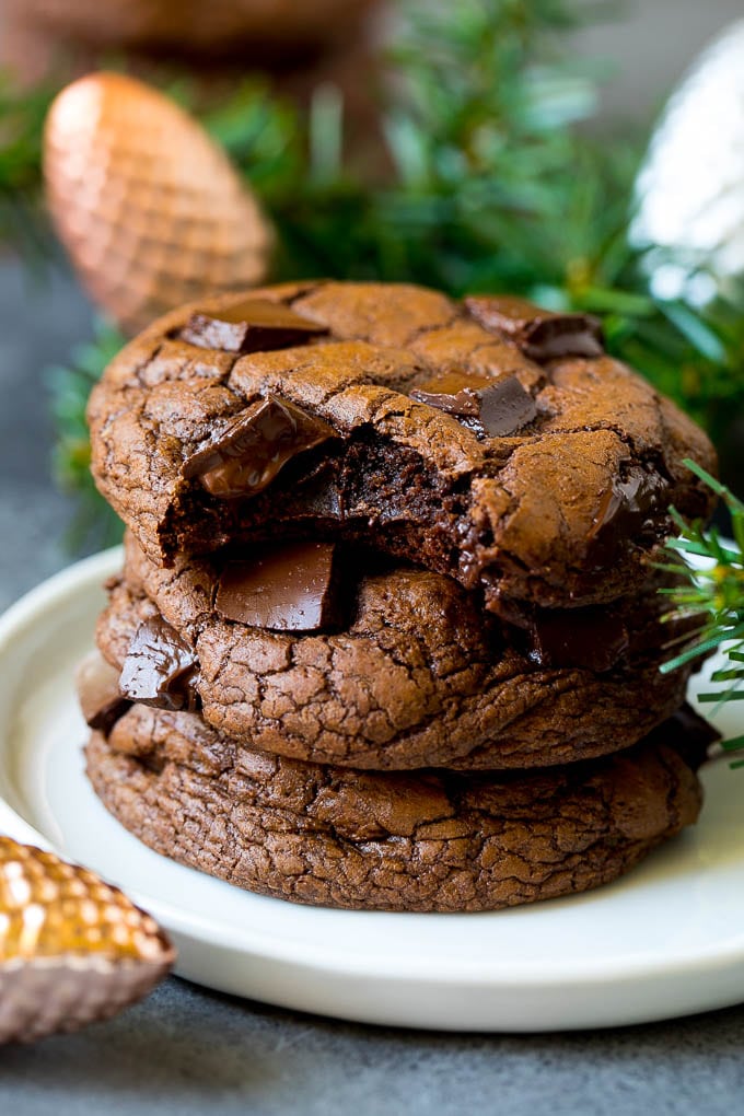 Brownie Cookies Recipe | Chocolate Cookies #cookies #brownies #chocolate #dessert #baking #ezlod A stack of brownie cookies with a bite taken out of one.