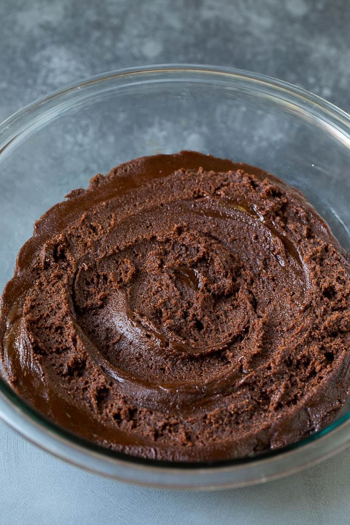 Chocolate Crinkle Cookies Recipe #cookies #chocolate #christmas #dessert #baking #ezlod A bowl of chocolate cookie dough.