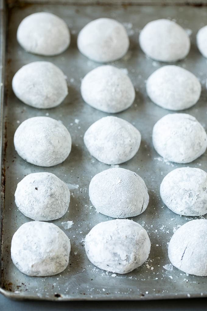 Chocolate Crinkle Cookies Recipe #cookies #chocolate #christmas #dessert #baking #ezlod Balls of cookie dough rolled in powdered sugar.