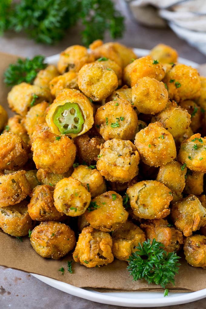Fried Okra Recipe #okra #appetizer #sidedish #ezlod A serving plate of fried okra garnished with parsley.