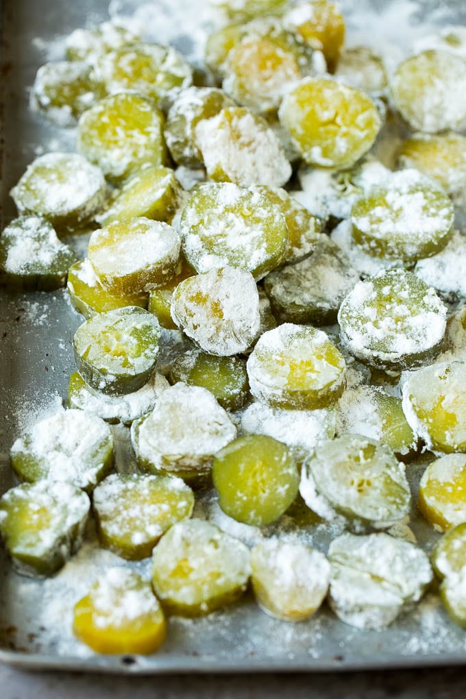 Fried Pickles Recipe #pickles #appetizer #snack #ezlod Pickle slices coated in flour.