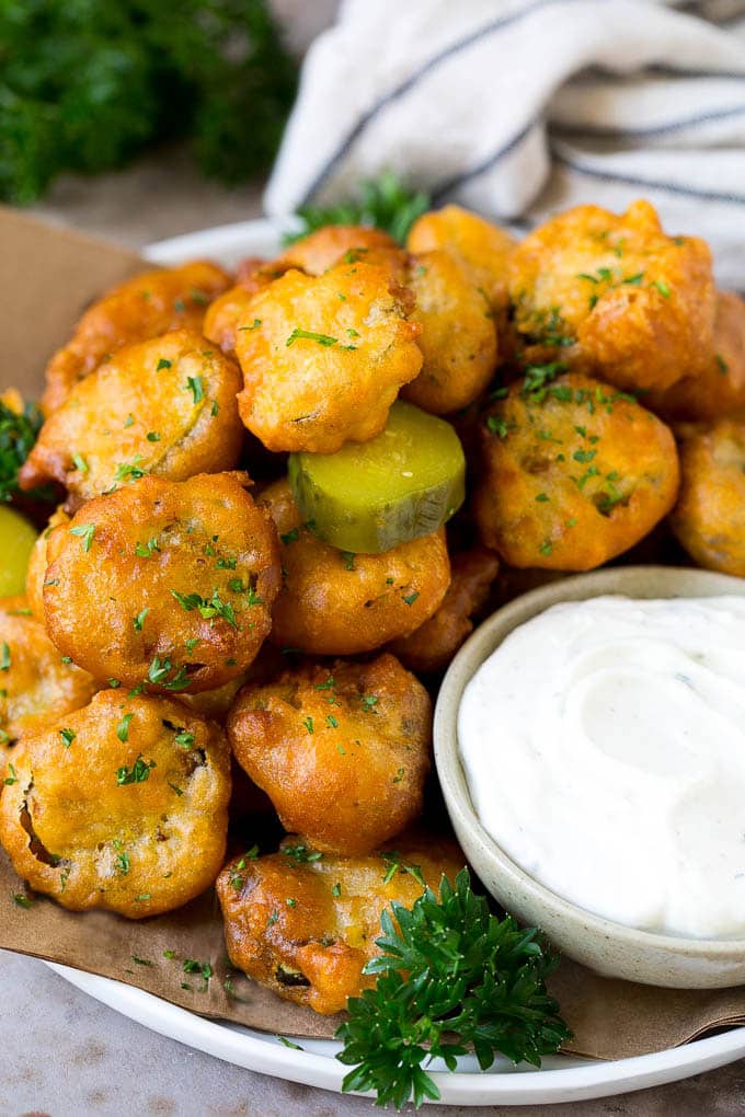 Fried Pickles Recipe #pickles #appetizer #snack #ezlod A plate of fried pickles, served with ranch dip.