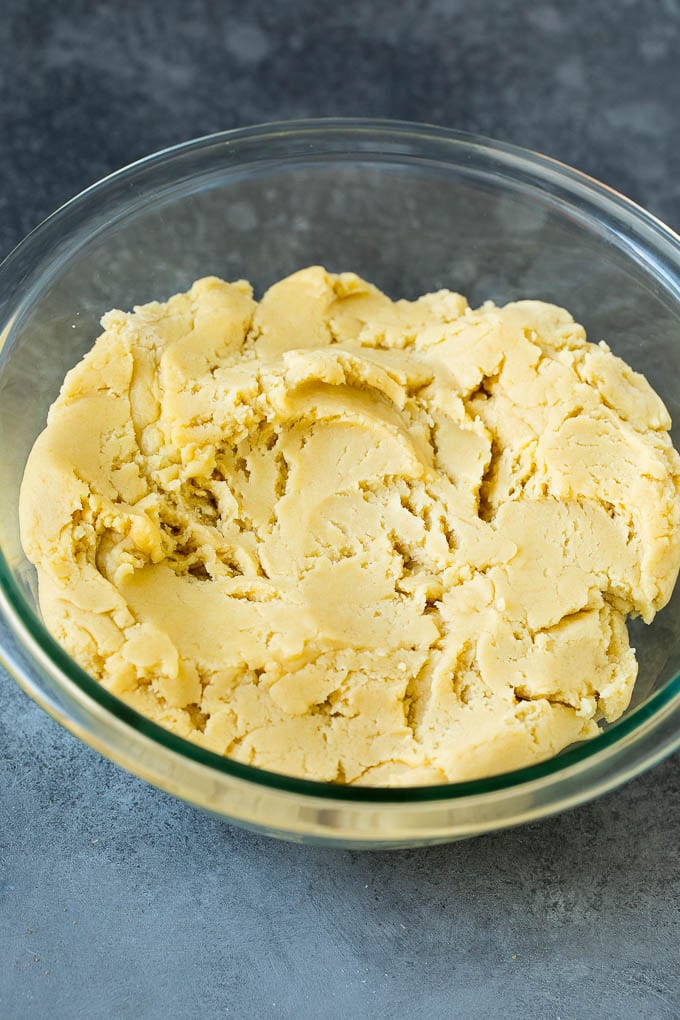Italian Cookies Recipe | Almond Cookies #cookies #italianfood #frosting #sprinkles #baking #christmas #ezlod Almond cookie dough in a mixing bowl.