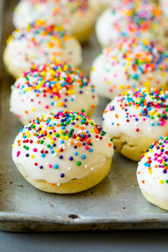 Italian Cookies Recipe | Almond Cookies #cookies #italianfood #frosting #sprinkles #baking #christmas #ezlod Italian cookies covered in frosting and rainbow sprinkles.