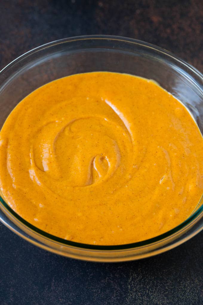 Pumpkin Cake Recipe | Pumpkin Spice Cake #cake #pumpkin #dessert #baking #fall #thanksgiving #ezlod Cake batter in a mixing bowl.
