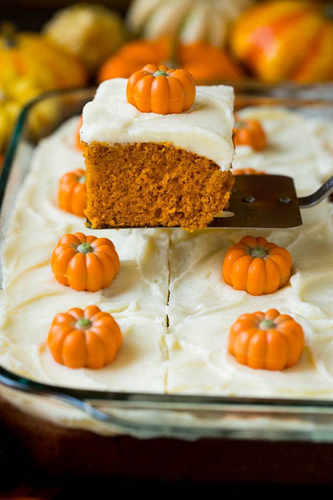 Pumpkin Cake Recipe | Pumpkin Spice Cake #cake #pumpkin #dessert #baking #fall #thanksgiving #ezlod A spatula serving up a slice of pumpkin cake.