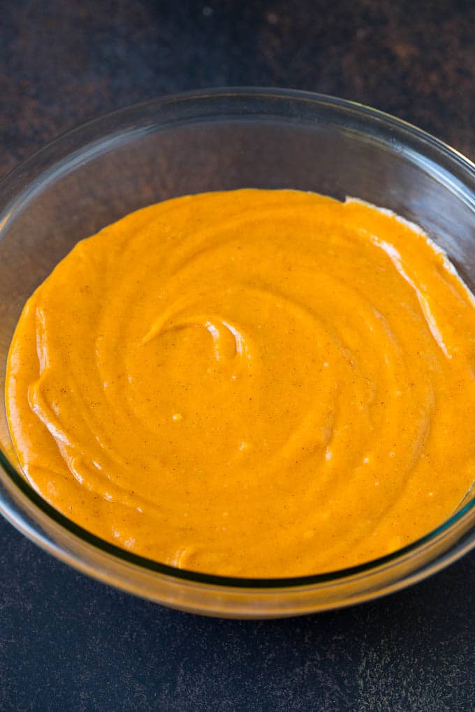 Pumpkin Cupcakes Recipe | Pumpkin Cake #cake #cupcakes #pumpkin #frosting #baking #fall #thanksgiving #ezlod A bowl of batter.