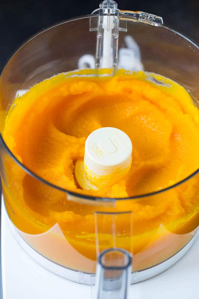 Pumpkin Puree Recipe #pumpkin #baking #fall #thanksgiving #ezlod Pureed pumpkin in a food processor.