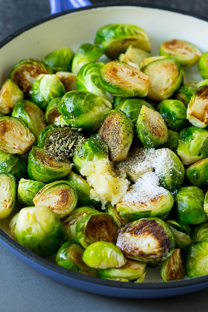 Sauteed Brussels Sprouts Recipe | Brussels Sprouts Side Dish #brusselssprouts #sprouts #veggies #sidedish #garlic #vegetarian #dinner #ezlod Sprouts in a pan seasoned with salt, pepper, garlic and dried herbs.