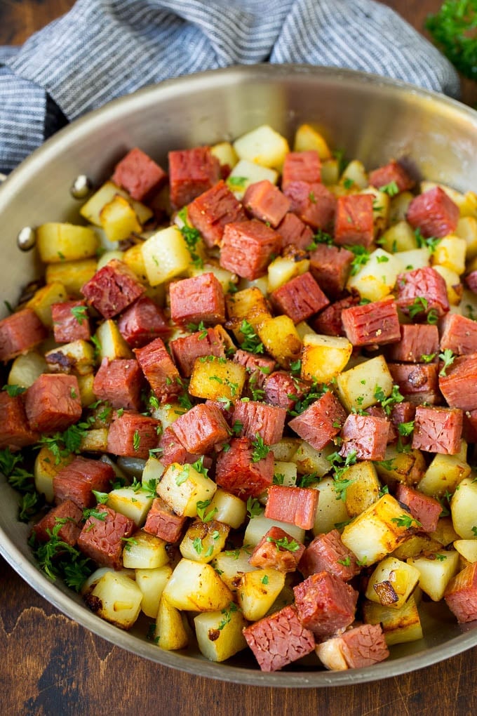 Corned Beef Hash Recipe #hash #cornedbeef #stpatricksday #breakfast #brunch #potatoes #ezlod Corned beef hash with potatoes, onions and fresh herbs.