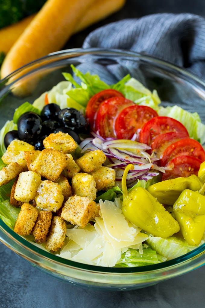 Olive Garden Salad Recipe | Italian Salad #salad #lettuce #olives #sidedish #dinner #ezlod Olive Garden salad with tomatoes, croutons, cheese and olives.