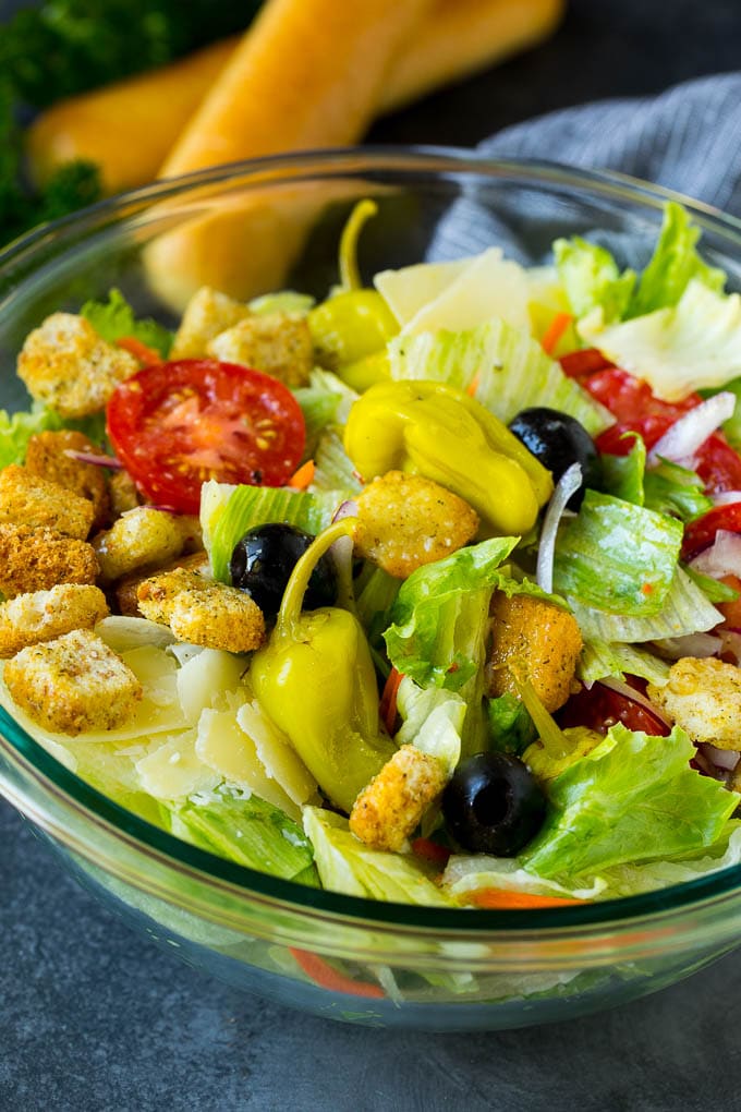 Olive Garden Salad Recipe | Italian Salad #salad #lettuce #olives #sidedish #dinner #ezlod A tossed Olive Garden salad with Italian dressing, vegetables and olives.