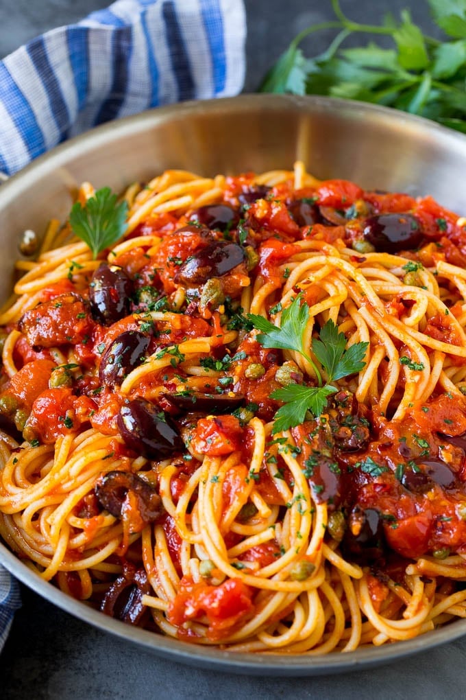 Pasta Puttanesca Recipe #pasta #tomatoes #olives #italianfood #dinner #ezlod Pasta puttanesca with olives and capers in tomato sauce.