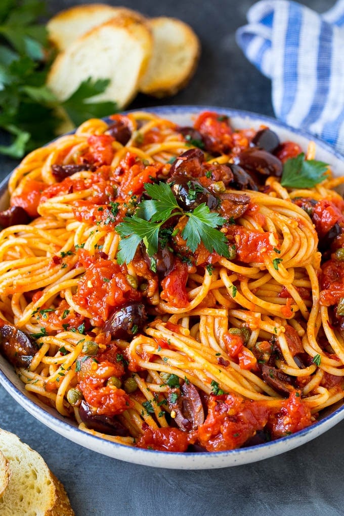 Pasta Puttanesca Recipe #pasta #tomatoes #olives #italianfood #dinner #ezlod Pasta puttanesca with spaghetti tossed in a homemade tomato sauce.