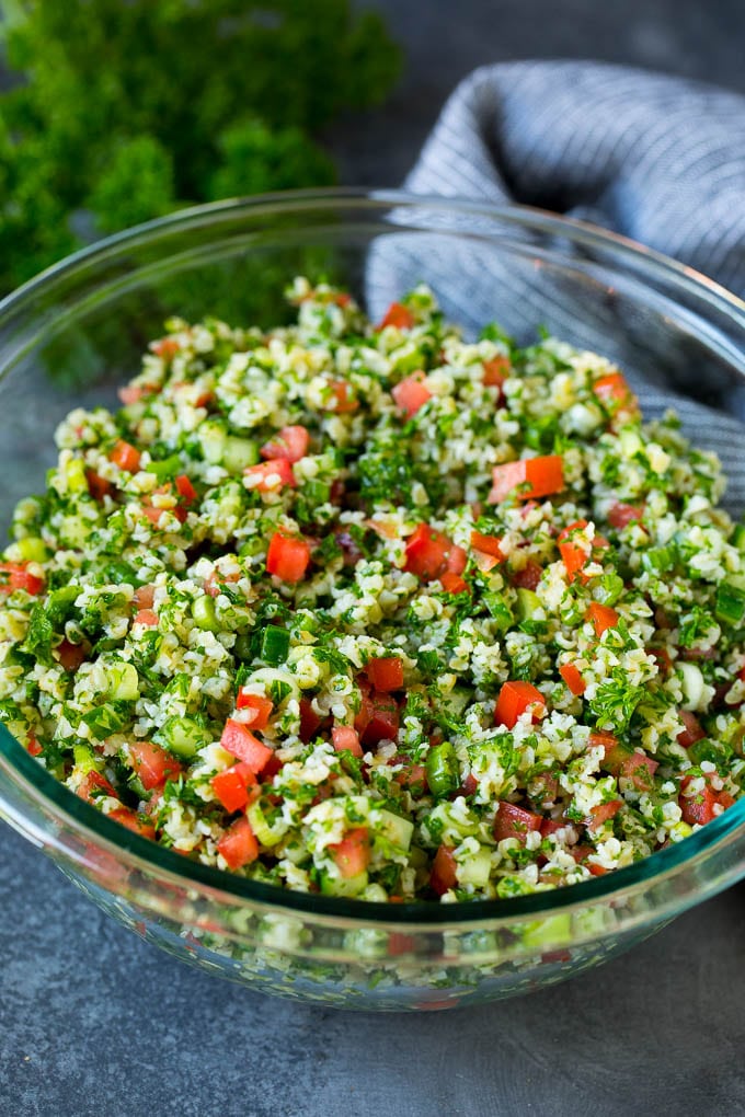 Tabbouleh Salad | Tabouli #salad #wheat #tomatoes #cucumber #healthy #sidedish #dinner #ezlod A serving bowl filled with tabbouleh salad.