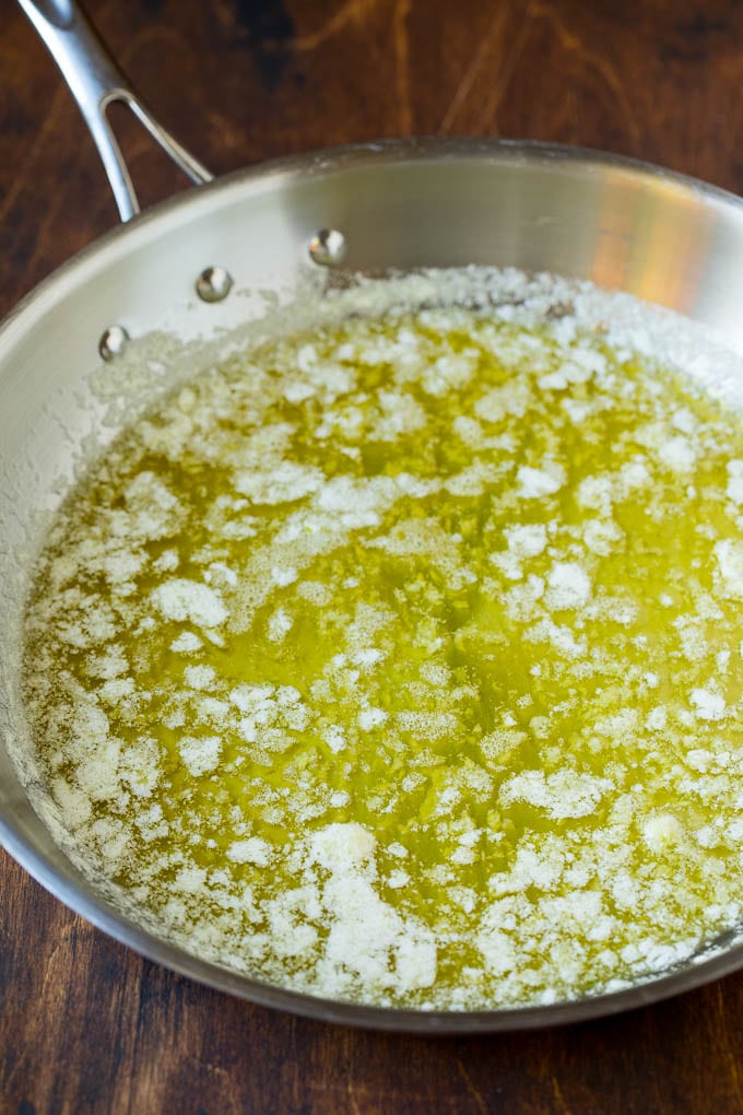 Garlic and Herb Angel Hair Pasta #pasta #garlic #sidedish #dinner #ezlod Melted butter with garlic and olive oil in a pan.