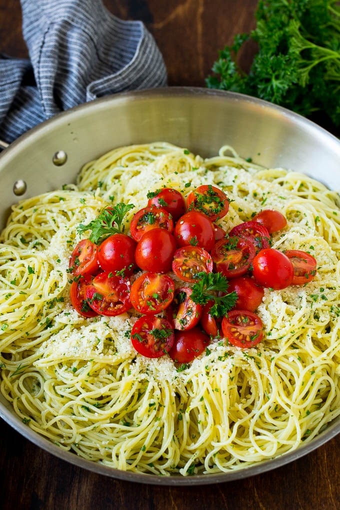 Garlic and Herb Angel Hair Pasta #pasta #garlic #sidedish #dinner #ezlod Garlic and herb angel hair pasta topped with fresh tomatoes.