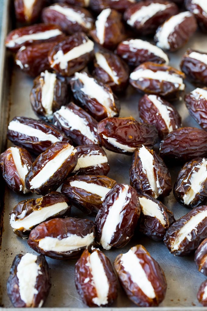 Bacon Wrapped Dates #appetizer #bacon #dates #cheese #ezlod Dates cut in half and filled with goat cheese.