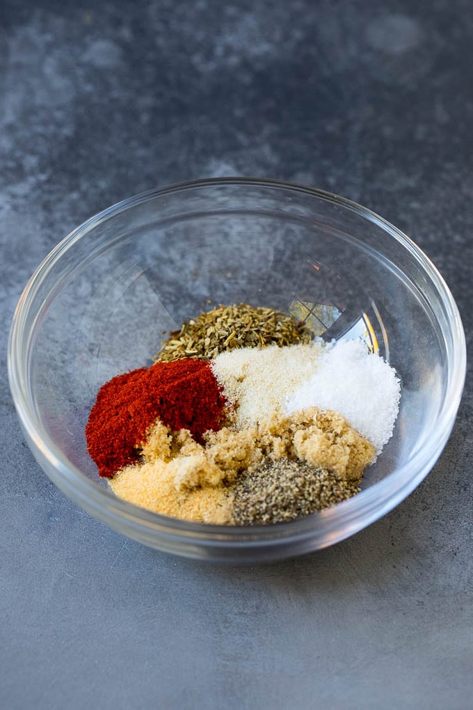 Baked Chicken Breast Recipe #chicken #dinner #ezlod Herbs and seasonings in a mixing bowl.