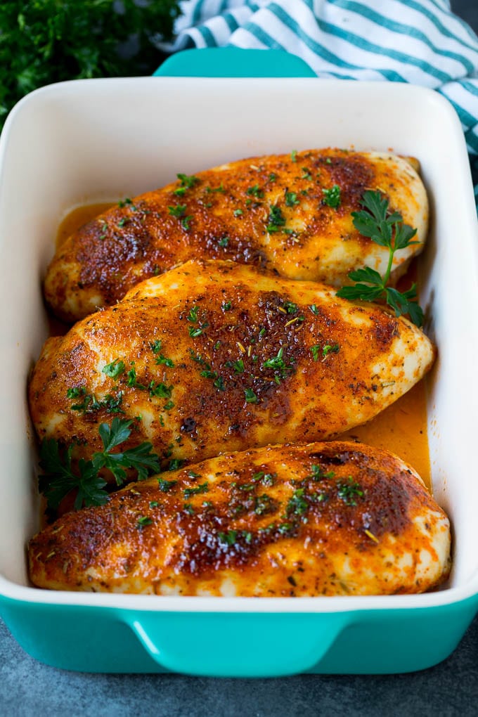 Baked Chicken Breast Recipe #chicken #dinner #ezlod Baked chicken breast topped with fresh chopped parsley.