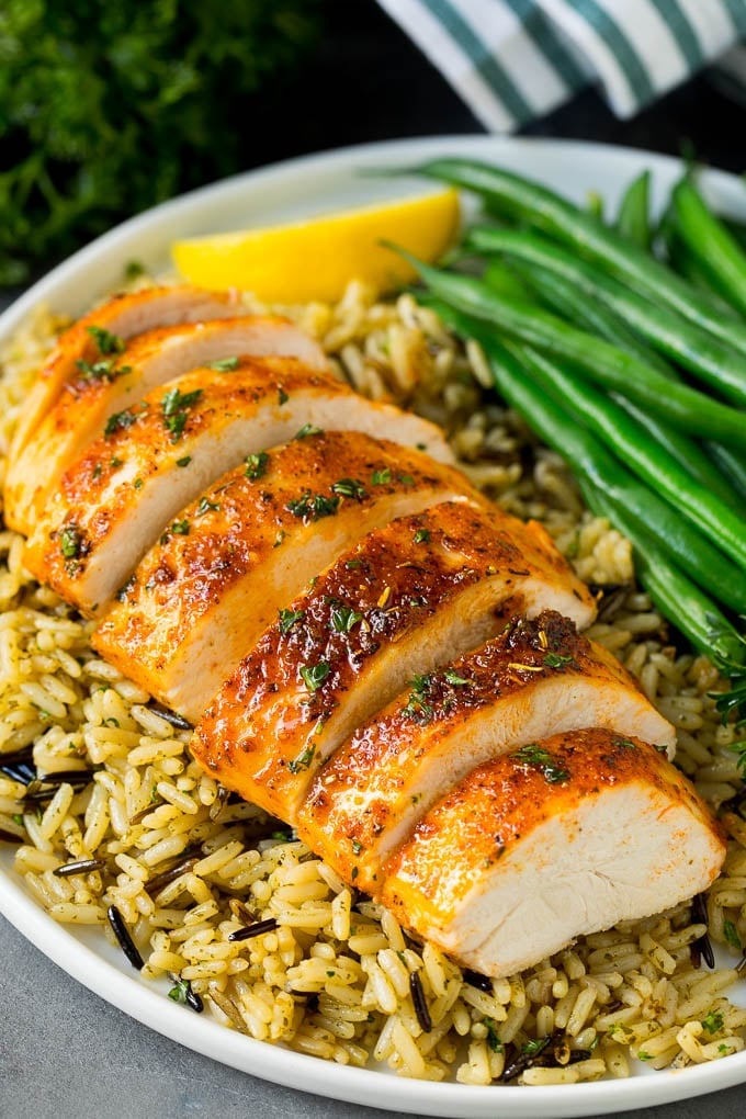 Baked Chicken Breast Recipe #chicken #dinner #ezlod Baked chicken breast served with rice and green beans.
