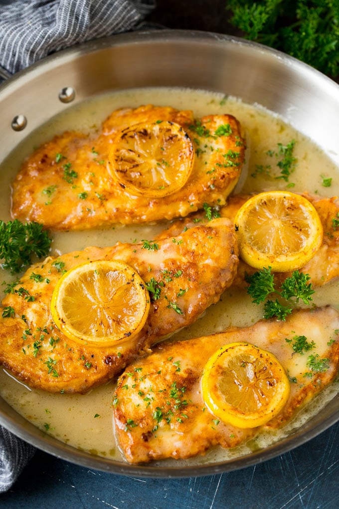 Chicken Francese Recipe #chicken #lemon #dinner #ezlod Chicken francese in a white wine sauce, garnished with lemon slices.