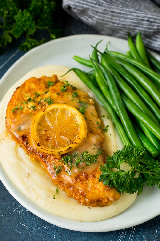 Chicken Francese Recipe #chicken #lemon #dinner #ezlod Chicken francese served over mashed potatoes with green beans.