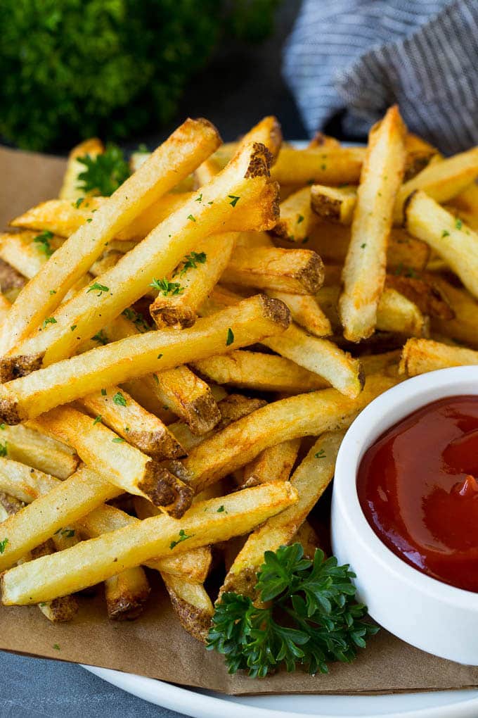 Homemade French Fries Recipe #potatoes #fries #dinner #ezlod A plate of homemade french fries served with a bowl of ketchup.
