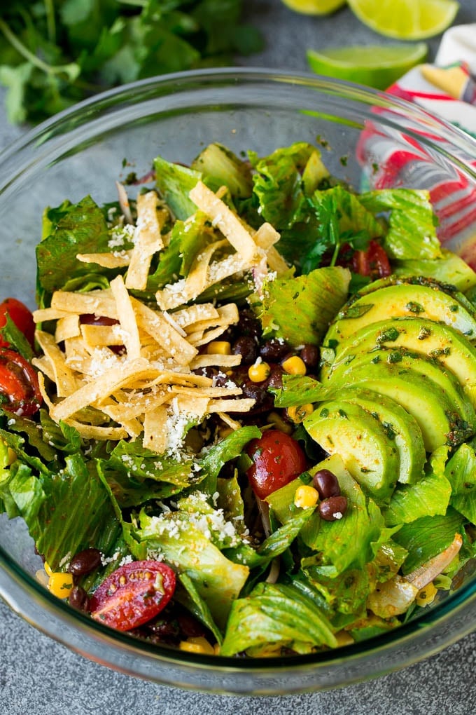 Mexican Salad Recipe #salad #corn #beans #avocado #tomatoes #ezlod Mexican salad with lettuce, corn, beans and tomato, tossed in a lime dressing.