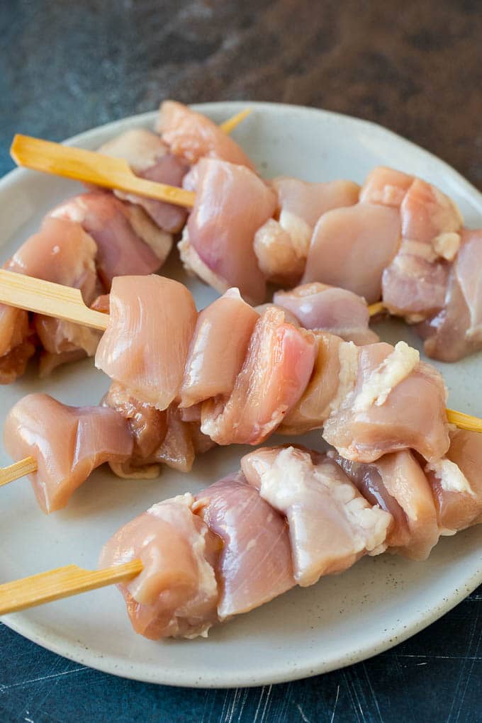 Chicken Yakitori Recipe | Grilled Chicken #chicken #grilling #dinner #ezlod Raw chicken threaded onto skewers.