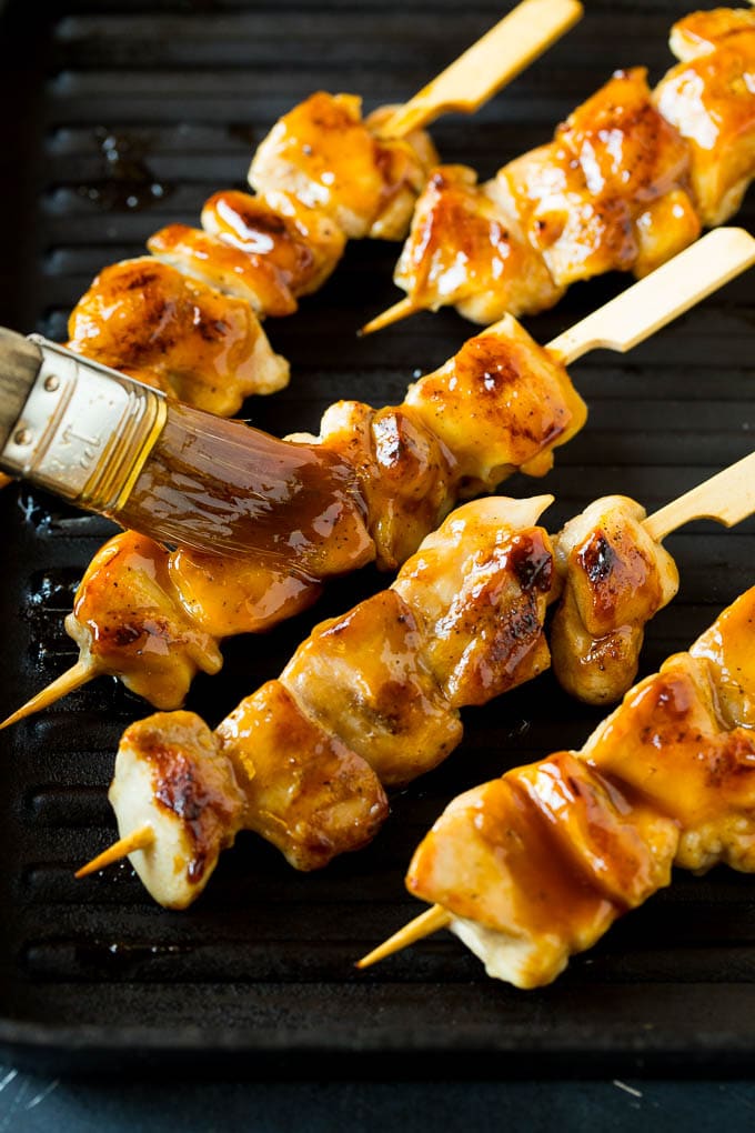 Chicken Yakitori Recipe | Grilled Chicken #chicken #grilling #dinner #ezlod A basting brush putting sauce onto grilled chicken yakitori..