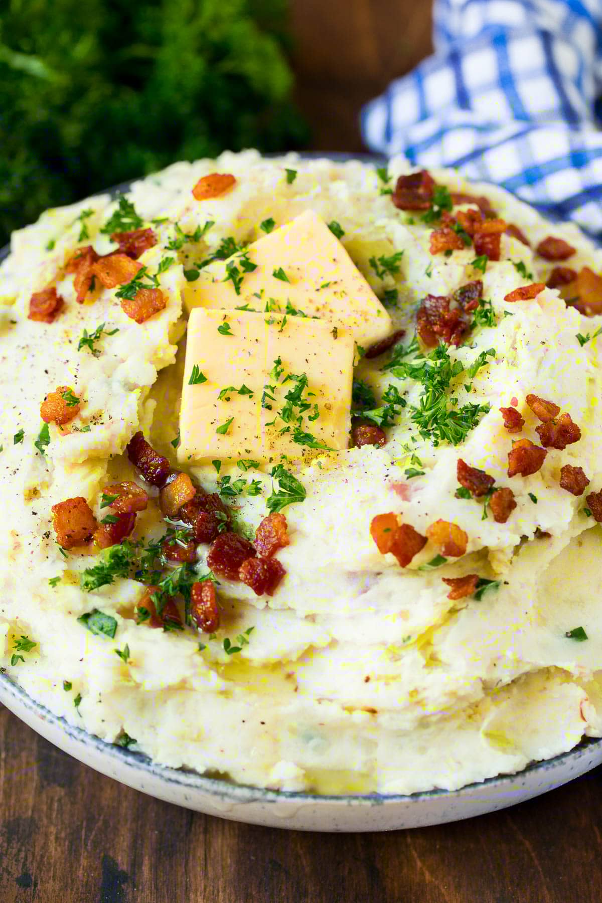 Colcannon Recipe | Mashed Potatoes #potatoes #cabbage #bacon #sidedish #stpatricksday #dinner #ezlod A serving bowl of colcannon topped with butter and herbs.