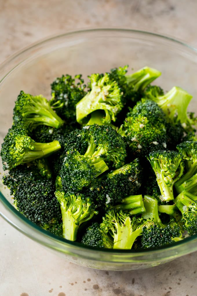 Grilled broccoli is packed with flavor and is a colorful and healthy side dish! #broccoli #ezlod Florets tossed with olive oil, garlic and herbs.