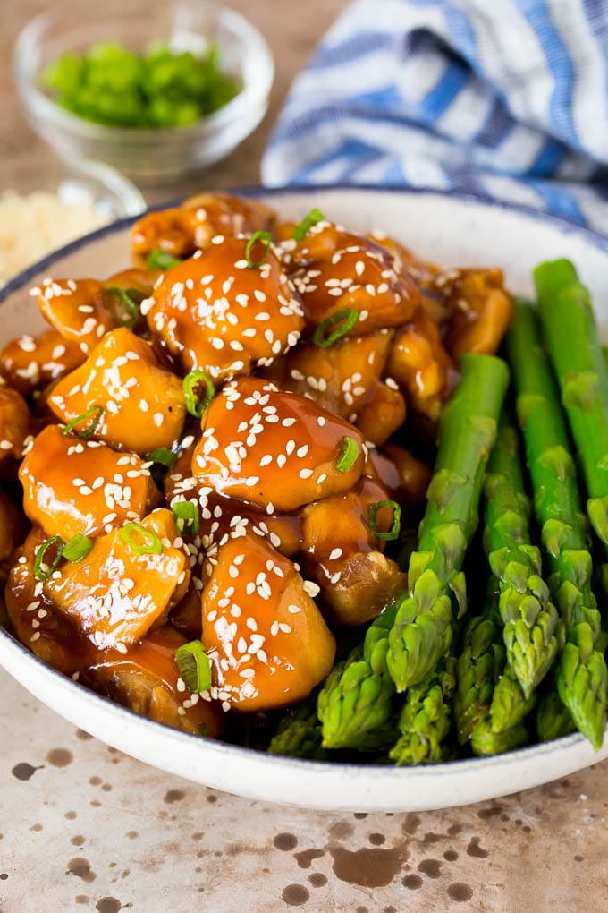This Instant Pot teriyaki chicken is chicken thighs pressured cooked in a homemade sweet and savory teriyaki sauce. Instant Pot teriyaki chicken served with asparagus.