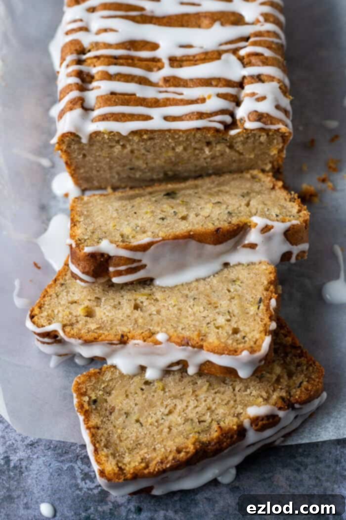 Close-up detail of perfectly cut individual slices of vegan courgette cake, showcasing the moist, tender interior and delicate crumb, inviting you to take a bite.