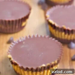 Close-up of a homemade Chocolate Pumpkin Cup, showing the distinct chocolate and pumpkin layers.
