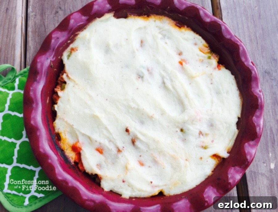 Portion of skinny shepherd's pie showing layers of turkey and mash