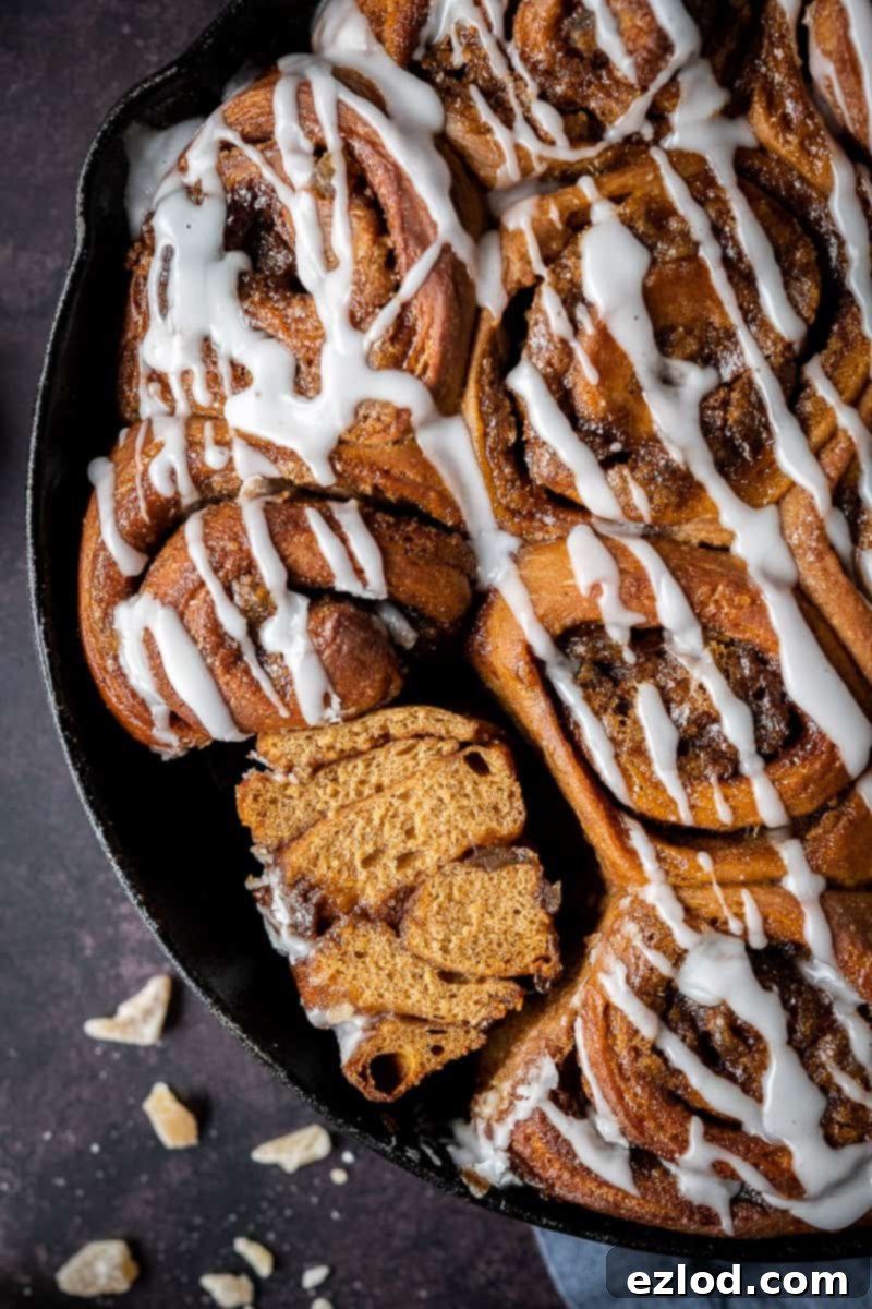close up of a ginger cinnamon roll sliced in half