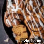 close up of a ginger cinnamon roll sliced in half
