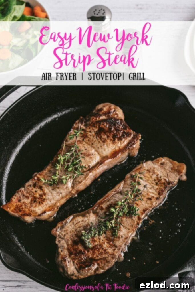 Overhead photo of Two New York Strip Steaks grilled in a Cast Iron Skillet with salt and pepper shakers and a salad in the background. With the text overlay- Easy New York Strip Steak | Air Fryer | Stovetop | Grill | Confessions of a Fit Foodie