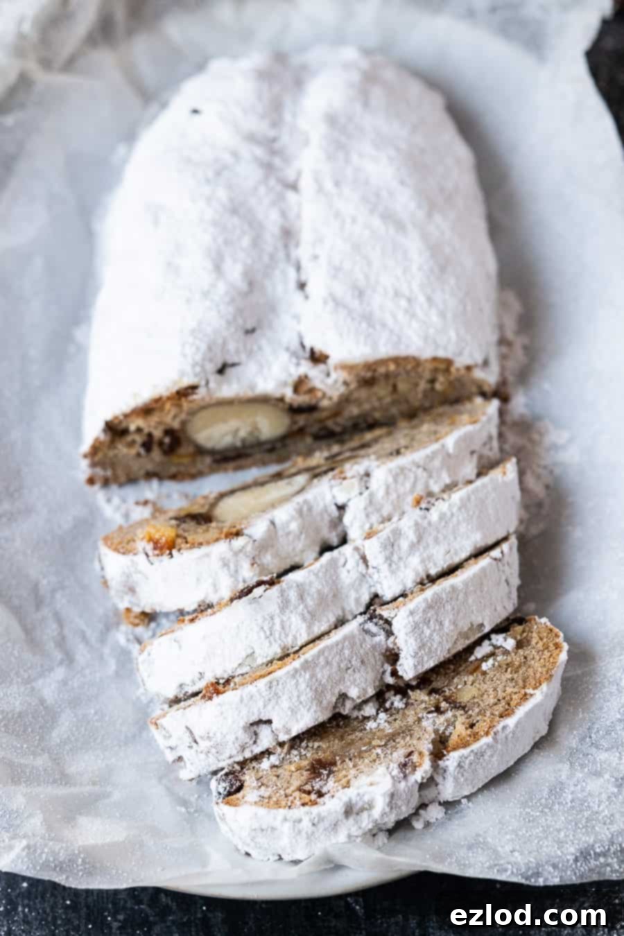 a sliced loaf of icing sugar coated stollen.